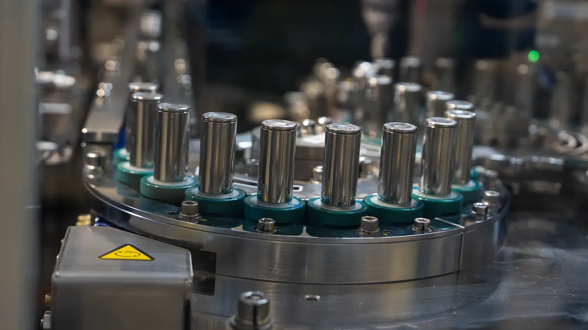 Battery cells moving through an automated manufacturing line