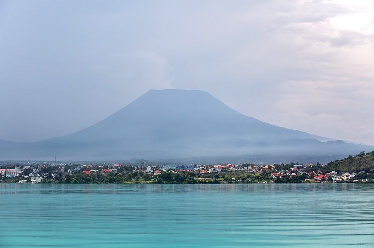 Goma on the shore of Lake Kivu beneath the Nyiragongo volcano